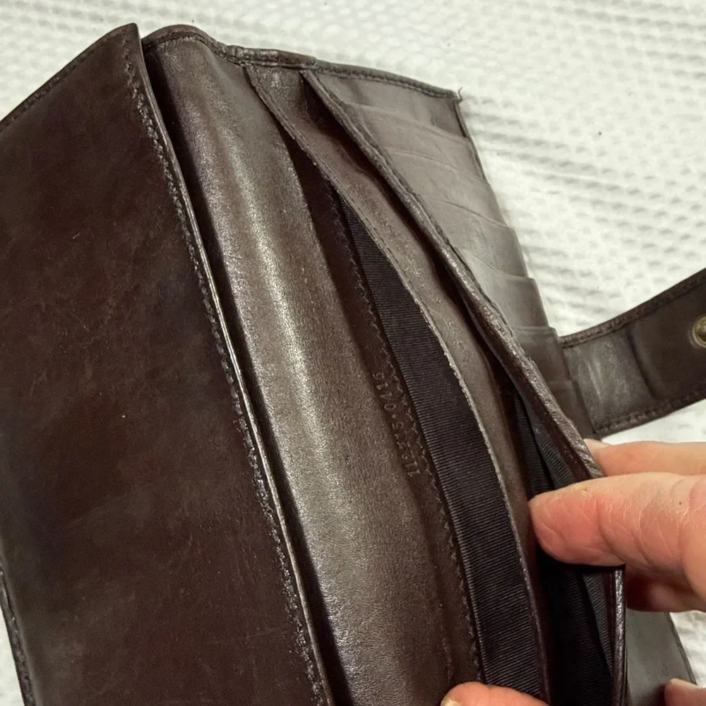 Gucci Dark Brown Embossed Clutch wallet inside is clean. GUC much life left!